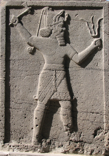 Teshub holding axe & trident-thunderbolts neo-Hittite stele
